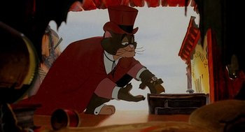 Movie still from “An American Tail: Fievel Goes West” (1991), directed by Simon Wells – A cat wearing a top hat and a red jacket; Medium shot, Low angle
