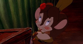 Movie still from “An American Tail: Fievel Goes West” (1991), directed by Simon Wells – A cartoon character with a flower in her hair; Close Up shot, High angle