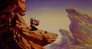 Movie still from “An American Tail: Fievel Goes West” (1991), directed by Simon Wells – A painting of a mouse sitting on top of a mountain; Wide shot, High angle