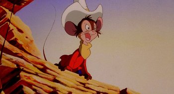 Movie still from “An American Tail: Fievel Goes West” (1991), directed by Simon Wells – A mouse wearing a cowboy hat sitting on top of a roof; Close Up shot, High angle