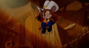 Movie still from “An American Tail: Fievel Goes West” (1991), directed by Simon Wells – A cartoon of a mouse wearing a cowboy hat; Medium shot, High angle