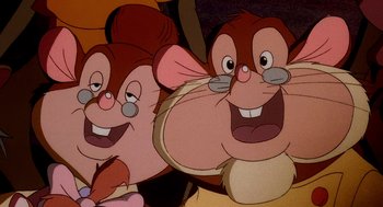 Movie still from “An American Tail: Fievel Goes West” (1991), directed by Simon Wells – A couple of cartoon characters that are next to each other; Close Up shot, Low angle