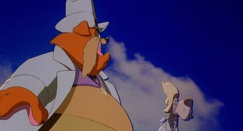 Movie still from “An American Tail: Fievel Goes West” (1991), directed by Simon Wells – Two cartoon characters are looking at each other; Medium shot, Low angle