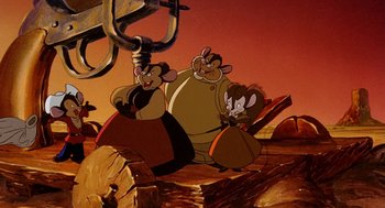Movie still from “An American Tail: Fievel Goes West” (1991), directed by Simon Wells – A group of cartoon characters sitting on top of rocks; Wide shot, High angle