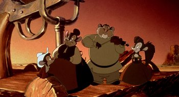 Movie still from “An American Tail: Fievel Goes West” (1991), directed by Simon Wells – A group of people that are standing in the dirt; Wide shot, Low angle