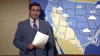 Movie still from “Anchorman: The Legend of Ron Burgundy” (2004), directed by Adam McKay – A man standing in front of a map holding a piece of paper; Medium shot, Low angle