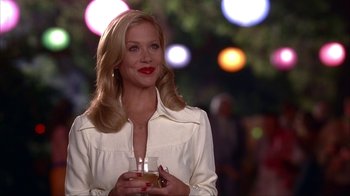 Movie still from “Anchorman: The Legend of Ron Burgundy” (2004), directed by Adam McKay – A woman holding a drink in her hand; Medium shot, Over the shoulder angle