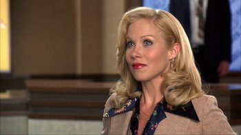 Movie still from “Anchorman: The Legend of Ron Burgundy” (2004), directed by Adam McKay – A woman with blonde curly hair and blue eyes; Close Up shot, Over the shoulder angle