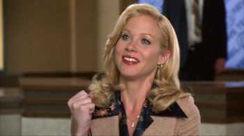 Movie still from “Anchorman: The Legend of Ron Burgundy” (2004), directed by Adam McKay – A woman with blond hair and a smile on her face; Close Up shot, Low angle