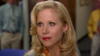 Movie still from “Anchorman: The Legend of Ron Burgundy” (2004), directed by Adam McKay – A person with blonde hair; Close Up shot, Over the shoulder angle