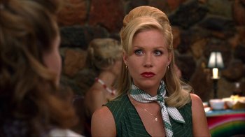 Movie still from “Anchorman: The Legend of Ron Burgundy” (2004), directed by Adam McKay – A woman with blonde hair wearing a green dress; Close Up shot, Over the shoulder angle