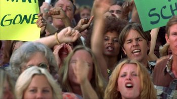 Movie still from “Anchorman: The Legend of Ron Burgundy” (2004), directed by Adam McKay – A group of people standing in the middle of a crowd; Medium shot, Low angle