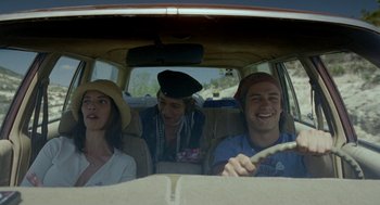 Movie still from “And Your Mother Too” (2001), directed by Alfonso Cuarón – A group of people sitting in the back of a car; Medium shot, Low angle