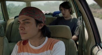 Movie still from “And Your Mother Too” (2001), directed by Alfonso Cuarón – Two young men sitting in the back seat of a car; Close Up shot, Over the shoulder angle