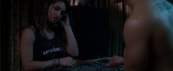 Movie still from “Angel of Anywhere” (2018), directed by James Kicklighter – A woman sitting in front of a sound board; Medium shot, Over the shoulder angle