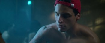 Movie still from “Angel of Anywhere” (2018), directed by James Kicklighter – A person wearing a hat; Close Up shot, Low angle