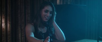 Movie still from “Angel of Anywhere” (2018), directed by James Kicklighter – A beautiful young lady sitting at a table; Close Up shot, Over the shoulder angle