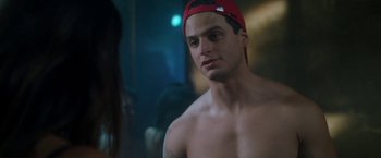 Movie still from “Angel of Anywhere” (2018), directed by James Kicklighter – A man in a red hat is looking at the camera; Close Up shot, Over the shoulder angle