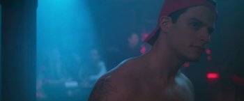 Movie still from “Angel of Anywhere” (2018), directed by James Kicklighter – A person with a hat on; Close Up shot, Over the shoulder angle