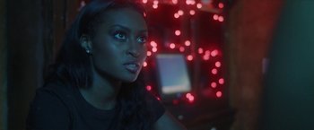 Movie still from “Angel of Anywhere” (2018), directed by James Kicklighter – A beautiful young lady looking into the distance; Close Up shot, Over the shoulder angle