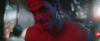 Movie still from “Angel of Anywhere” (2018), directed by James Kicklighter – A man's face in red light; Close Up shot, Low angle