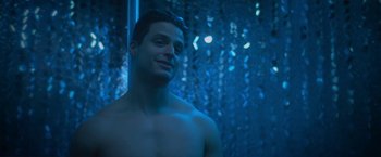 Movie still from “Angel of Anywhere” (2018), directed by James Kicklighter – A man in a blue light looking at the camera; Close Up shot, Low angle