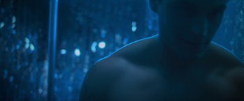 Movie still from “Angel of Anywhere” (2018), directed by James Kicklighter – A man with his back to the camera in the dark; Close Up shot, Low angle