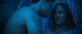 Movie still from “Angel of Anywhere” (2018), directed by James Kicklighter – A man and a woman in a blue room; Close Up shot, Over the shoulder angle