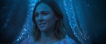 Movie still from “Angel of Anywhere” (2018), directed by James Kicklighter – A person wearing a dress; Close Up shot, Over the shoulder angle