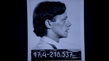 Movie still from “Angst” (1983), directed by Gerald Kargl – A black and white photo of a man's face; Close Up shot, Low angle