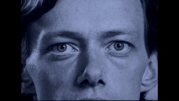 Movie still from “Angst” (1983), directed by Gerald Kargl – A man's eyes in a black - and - white photo; Close Up shot, Overhead angle