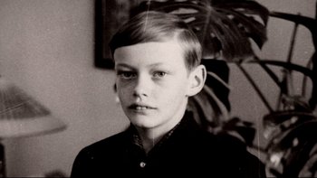 Movie still from “Angst” (1983), directed by Gerald Kargl – An old photo of a young boy in a black shirt; Close Up shot, High angle