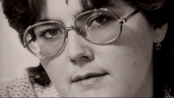 Movie still from “Angst” (1983), directed by Gerald Kargl – A woman's face wearing glasses; Extreme Close Up shot, High angle