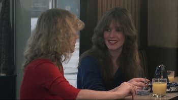 Movie still from “Angst” (1983), directed by Gerald Kargl – Two women sitting at a table talking to each other; Close Up shot, Over the shoulder angle