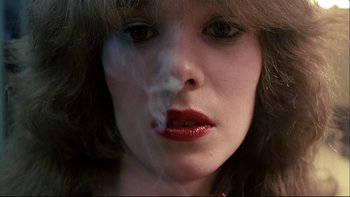 Movie still from “Angst” (1983), directed by Gerald Kargl – A person smoking a cigarette; Extreme Close Up shot, Low angle