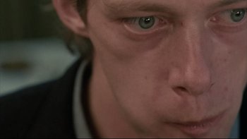 Movie still from “Angst” (1983), directed by Gerald Kargl – A person's eyes and face; Extreme Close Up shot, High angle