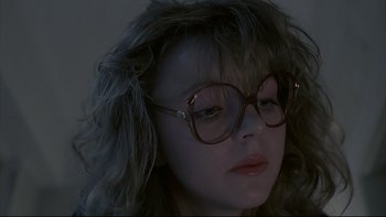 Movie still from “Angst” (1983), directed by Gerald Kargl – A person wearing glasses; Close Up shot, Low angle