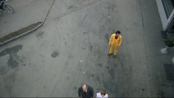 Movie still from “Angst” (1983), directed by Gerald Kargl – An overhead view of a man in a yellow suit; Extreme Wide shot, Overhead angle