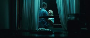 Movie still from “Animal Kingdom” (2010), directed by David Michôd – A man and a woman standing next to each other; Medium shot, Over the shoulder angle