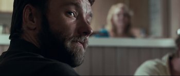 Movie still from “Animal Kingdom” (2010), directed by David Michôd – A person with a beard; Close Up shot, Over the shoulder angle