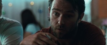 Movie still from “Animal Kingdom” (2010), directed by David Michôd – A person with a pen in his hand; Close Up shot, Over the shoulder angle
