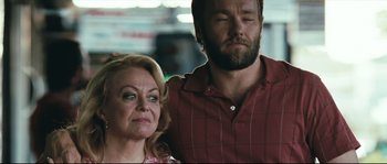 Movie still from “Animal Kingdom” (2010), directed by David Michôd – A man and a woman standing next to each other; Close Up shot, Over the shoulder angle