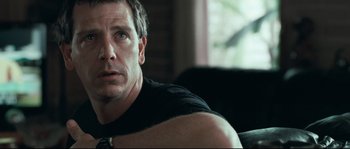 Movie still from “Animal Kingdom” (2010), directed by David Michôd – A person sitting on a couch; Close Up shot, Over the shoulder angle