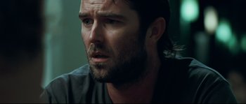Movie still from “Animal Kingdom” (2010), directed by David Michôd – A person with a beard; Close Up shot, Over the shoulder angle