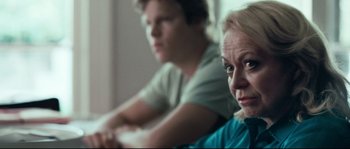 Movie still from “Animal Kingdom” (2010), directed by David Michôd – A woman and a man sitting on a couch; Close Up shot, Over the shoulder angle