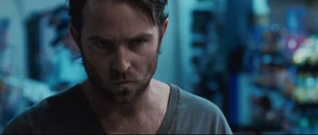 Movie still from “Animal Kingdom” (2010), directed by David Michôd – A person wearing a shirt; Close Up shot, Over the shoulder angle