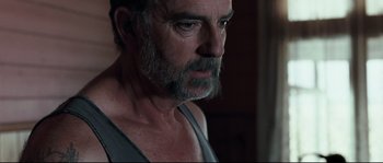 Movie still from “Animal Kingdom” (2010), directed by David Michôd – A person with a beard; Close Up shot, Low angle