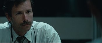 Movie still from “Animal Kingdom” (2010), directed by David Michôd – A person wearing a white shirt; Close Up shot, Over the shoulder angle