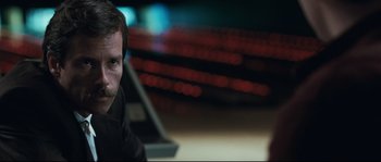 Movie still from “Animal Kingdom” (2010), directed by David Michôd – A person sitting in a room; Close Up shot, Over the shoulder angle