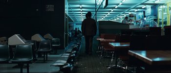 Movie still from “Animal Kingdom” (2010), directed by David Michôd – A man walking down a hallway in a restaurant; Wide shot, Over the shoulder angle